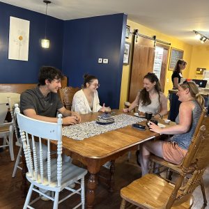 Summer Fellow Alec with ANCA staff at downtown bakery