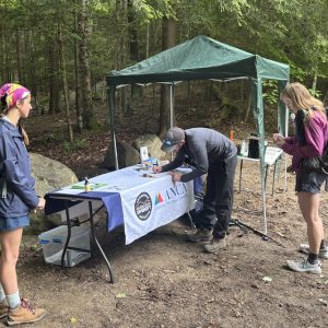 Leigha conducts surveys with hikers to the Adirondack High Peaks area.