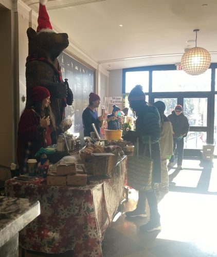 Shoppers at the indoor winter farmers market in Saranac Lake.